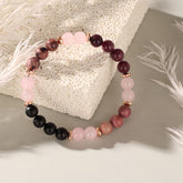 Handmade natural stone bracelet featuring Garnet, Rhodonite, and Pink Agate.